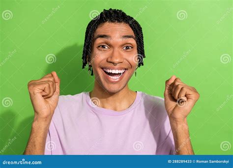 Portrait Of Overjoyed Glad Person Raise Fists Toothy Smile Attainment