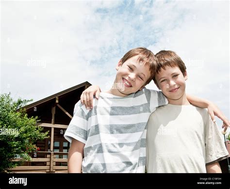 Two brothers hugging each other Stock Photo - Alamy