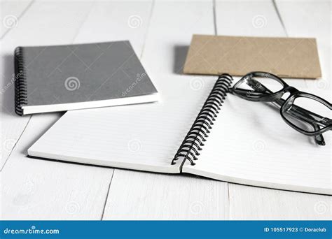 Notebook And Glasses On White Wooden Table Stock Image Image Of Notebook Background 105517923