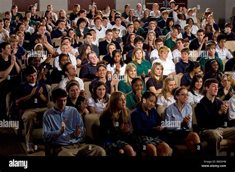 High School And Middle School Students Seated In An Auditorium Stock