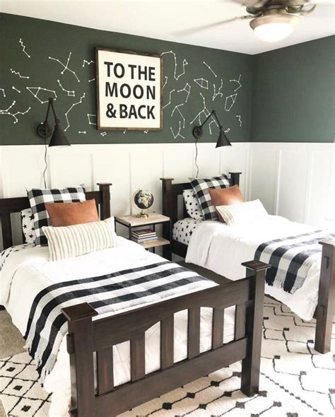 Two Twin Beds With Black And White Bedding In A Room That Has Stars On