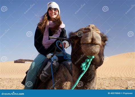 A Man Riding On A Camel On An Empty Beach Royalty-Free Stock ...