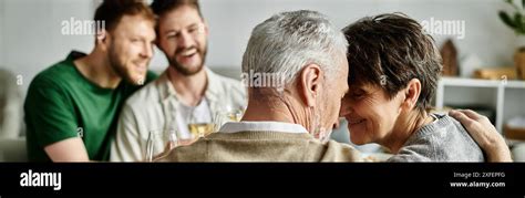 A Gay Couple Shares A Tender Moment With Parents In A Heartwarming Scene At Home Stock Photo Alamy