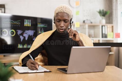 Portrait Of Smiling Confident African Young Male Office Manager In