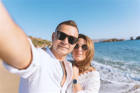 Young Happy Couple Taking Selfie On The Beach Summer Vacations Concept