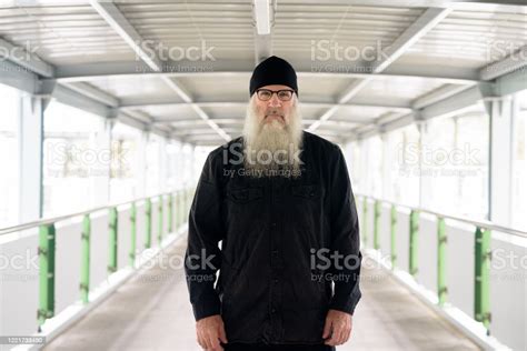 Mature Bearded Man With Eyeglasses At Footbridge In The City Stock