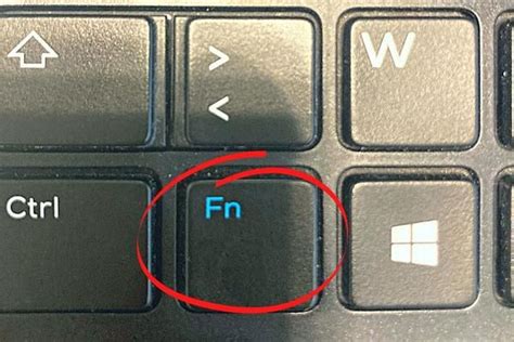 A Close Up Of A Computer Keyboard With The Word Fn Circled By An Arrow