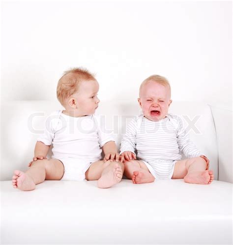 Two Sweet Babies One Looking One Crying Stock Photo Colourbox