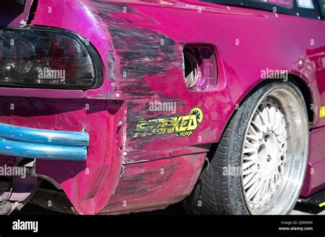 A Rear View Of The Bumps And Scratches Of A Purple Nissan Silvia S13