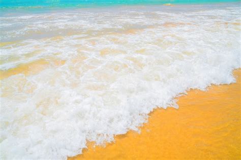 premium photo   yellow sand   ocean wave