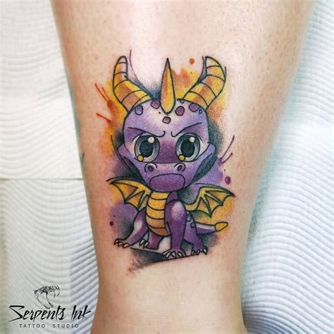 a small purple dragon tattoo on the leg