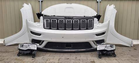 GRAND CHEROKEE WK2 FL MASKA BŁOTNIK XENON ZDERZAK 12679771140