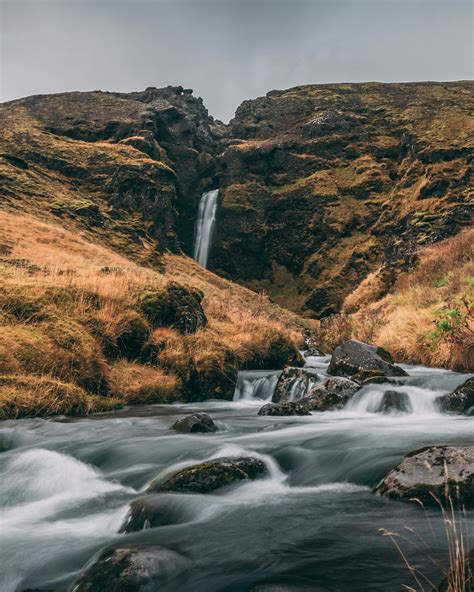 Waterfall in Between Rock Formations · Free Stock Photo