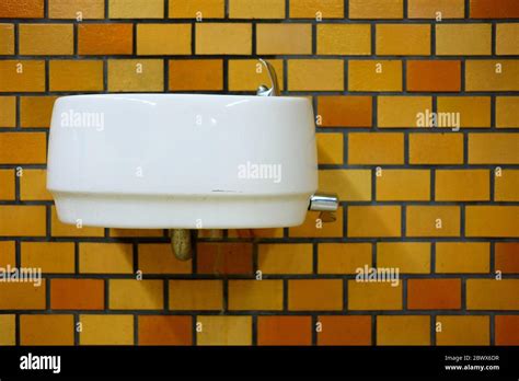 Old White Ceramic Sink On Brick Wall Stock Photo Alamy