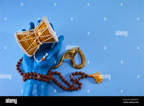 Shivaratri background with Shiva hand and Drum Damroo musical ...