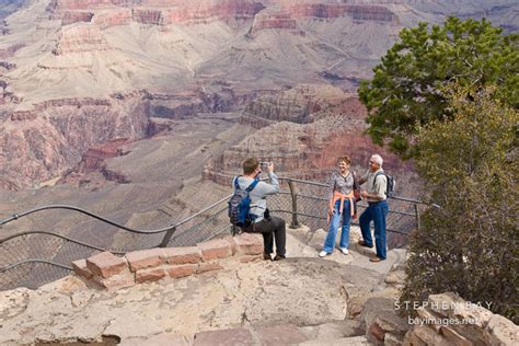 Photo: Tourists take photographs at Yavapai Pt. Grand Canyon NP, Arizona.