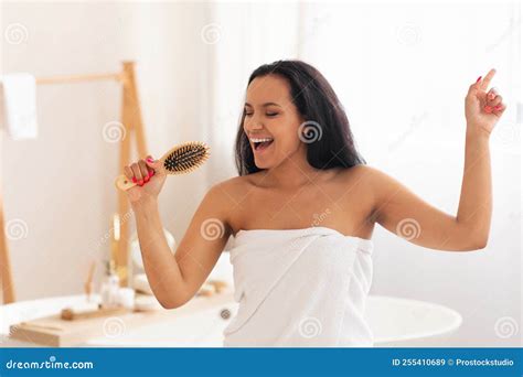 Female Having Fun Brushing Hair Singing Holding Hairbrush In Bathroom Stock Image Image Of