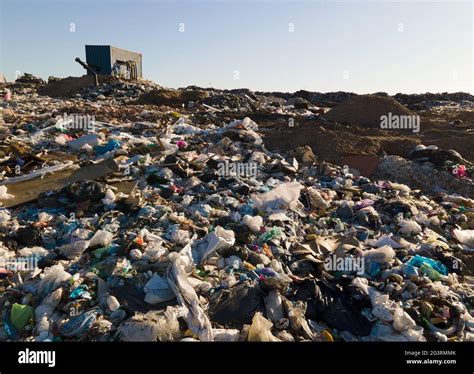 Garbage Dump With Plastic Bags And Food Waste Recycling Of Waste On