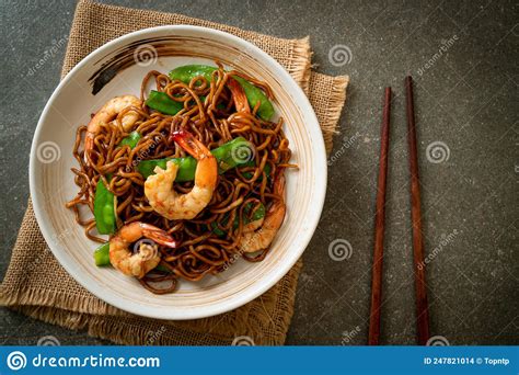 Stir Fried Yakisoba Noodles With Green Peas And Shrimps Stock Photo