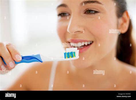 Model Released Woman Brushing Her Teeth Stock Photo Alamy