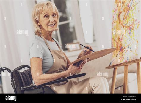 Positive Delighted Mature Woman Looking At Camera Stock Photo Alamy