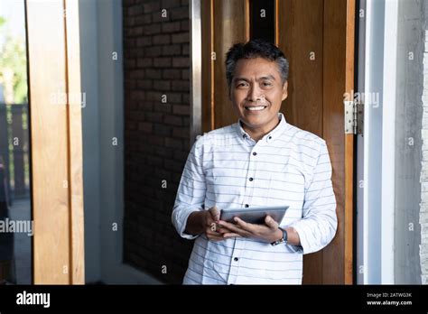 Asian Mature Businessman Using Tablet Pc Connect Trough Technology