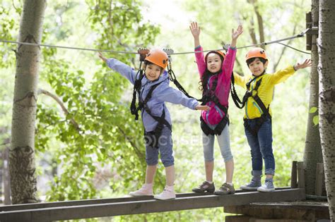 Chinese Children Posing In Tree Top Adventure Park — Daylight Nature