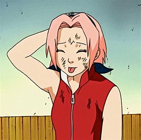 A Woman With Pink Hair And Black Eyes Wearing A Red Shirt Standing In