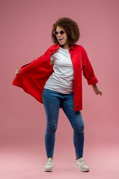 Premium Photo Pretty Curlyhaired Woman In Red Jacket And Sunglasses