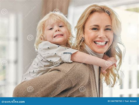 Time For Some Fun Shot Of A Mature Mother Enjoying Time With Her Son At Home Stock Photo