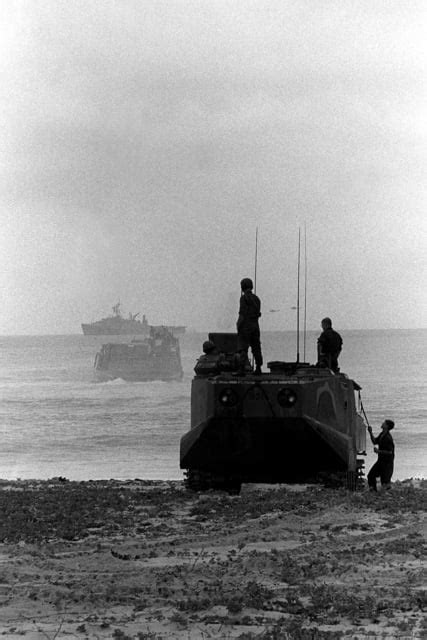 An LVTP 7 Tracked Landing Vehicle Comes Ashore During A Beach Assault