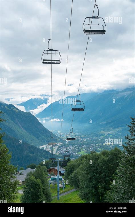 LES HOUCHES, FRANCE - AUGUST 23: Low angle shot of alpine air lift with Les Houches in the ...