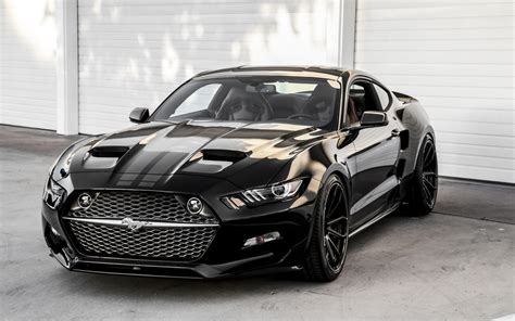 Beautiful black Ford Mustang Rocket in front of the garage