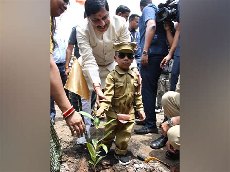 Mp Cm Mohan Yadav Plants Sapling With Police Officials As Part Of Ek