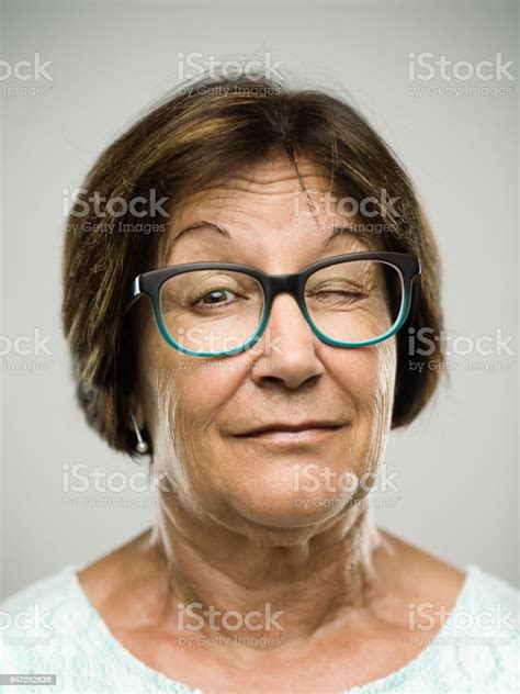 Real Senior Woman Portrait Winking Stock Photo Download Image Now