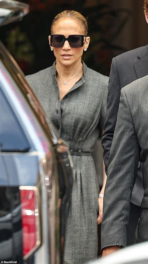 Jennifer Lopez Is Business Chic In A Gray Dress And Chunky Shades For