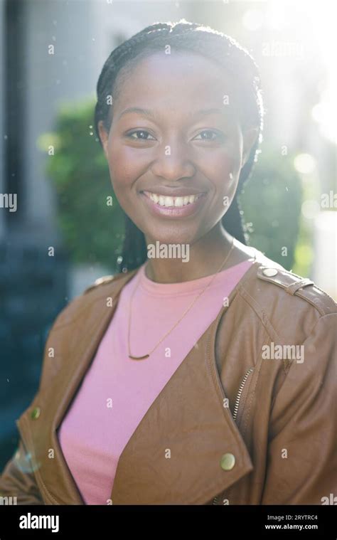 Portrait Of Happy African American Woman Wearing Leather Jacket