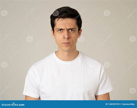 Portrait Of A Handsome Young Man With Angry Face Looking Disgusted