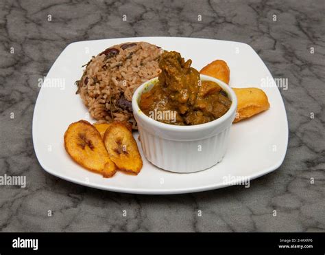 Curried Goat With Rice And Peas Jamaican And West Indian Food Stock Photo