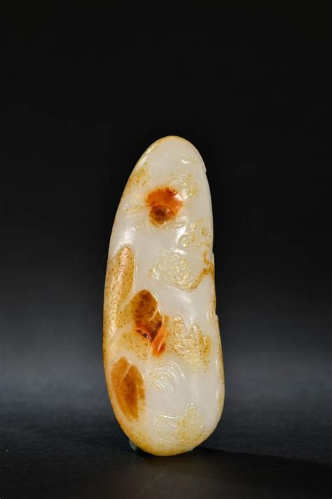 A Hetian Jade Raw Seed Ornament A Hetian Jade Raw Seed Ornament A