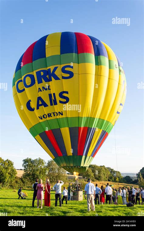 Hot Air Balloon Lifting Off In Field Near Braunton Devon England