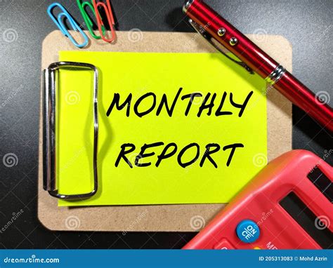 Text Monthly Report On Color Paper With Pencalculator And Paper Clips