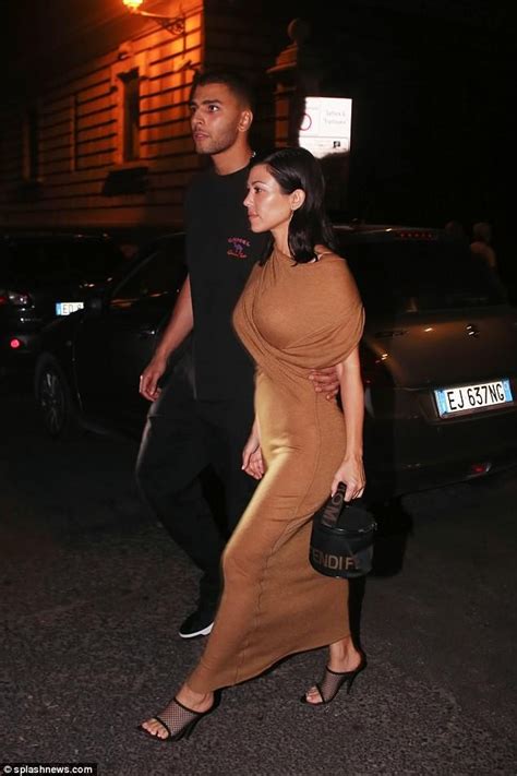 Kourtney Kardashian Flaunts Her Figure In Tight Beige Dress For Romantic Date Night With Toyboy