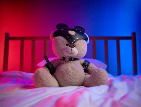 Premium Photo Bdsm Straps For Sex Games On A Teddy Bear In Neon Light