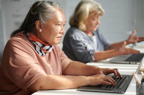 Premium Photo Elderly Woman Working On Laptop In Class For Seniors