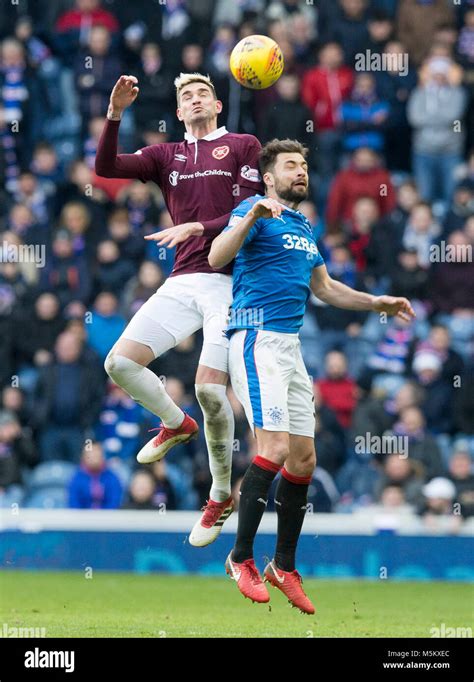 Rangers' Russell Martin (right) and Hearts' Kyle Lafferty (left) battle for the ball during the ...