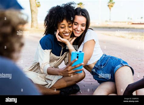 Happy Multiracial Women Friends Taking A Selfie With Smart Phone Outdoors Joyful Multiethnic