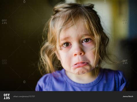 Portrait of a crying girl stock photo - OFFSET