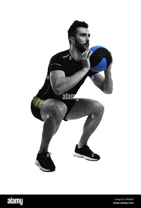 Athletic Man Doing Squats With Medicine Ball Isolated On White Stock