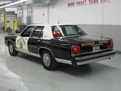 Black and White Police Car in Garage